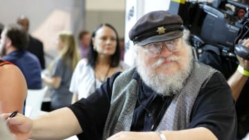 Writer George R.R. Martin of "Game of Thrones" signs autographs during the 2014 Comic-Con International Convention.