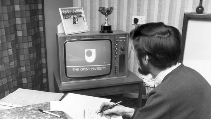 A man is pictured watching television
