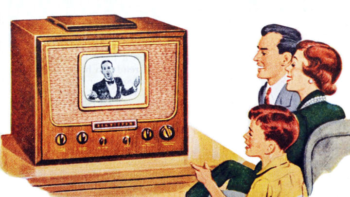 A family is pictured watching television